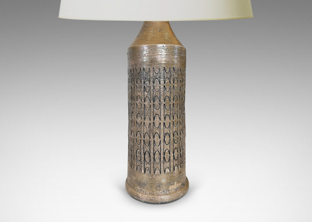 Gallery BAC columnar forms with carved ornamental motifs, glazed in a lightly lustrous grey-brown