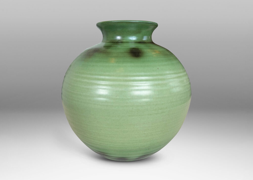 Gallery BAC ridged globe form with flared mouth, glazed in light and dark green tones