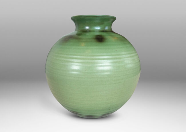 Gallery BAC ridged globe form with flared mouth, glazed in light and dark green tones