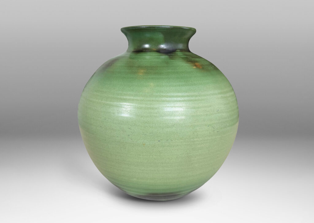 Gallery BAC ridged globe form with flared mouth, glazed in light and dark green tones