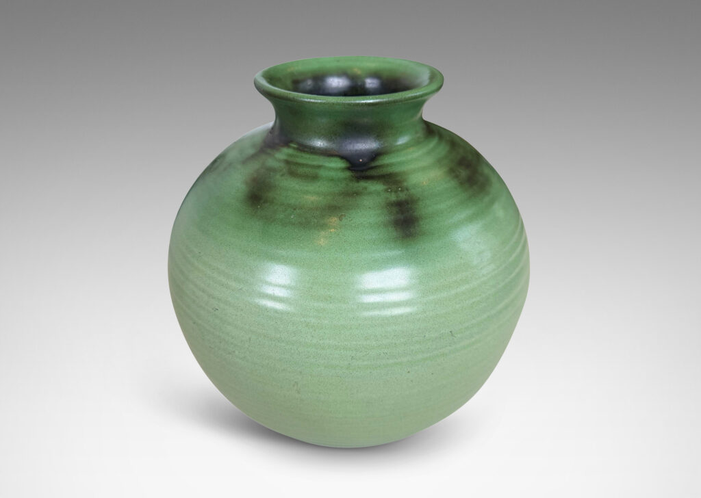Gallery BAC ridged globe form with flared mouth, glazed in light and dark green tones