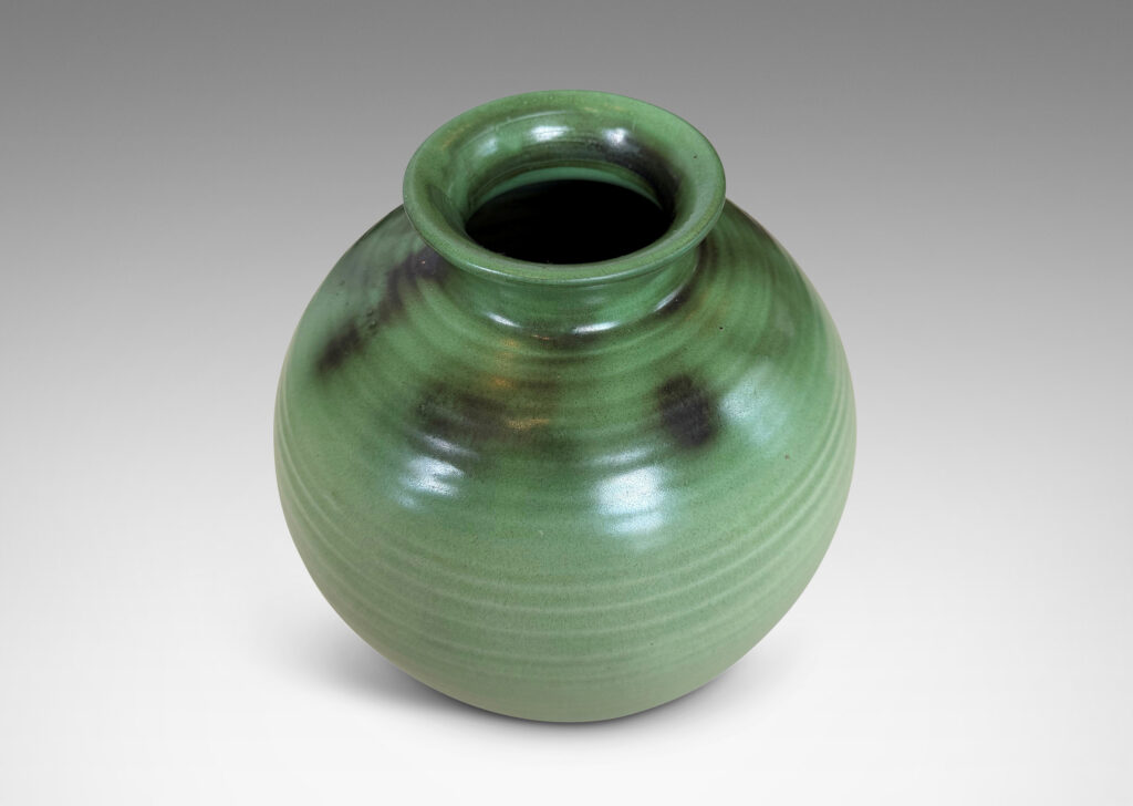Gallery BAC ridged globe form with flared mouth, glazed in light and dark green tones