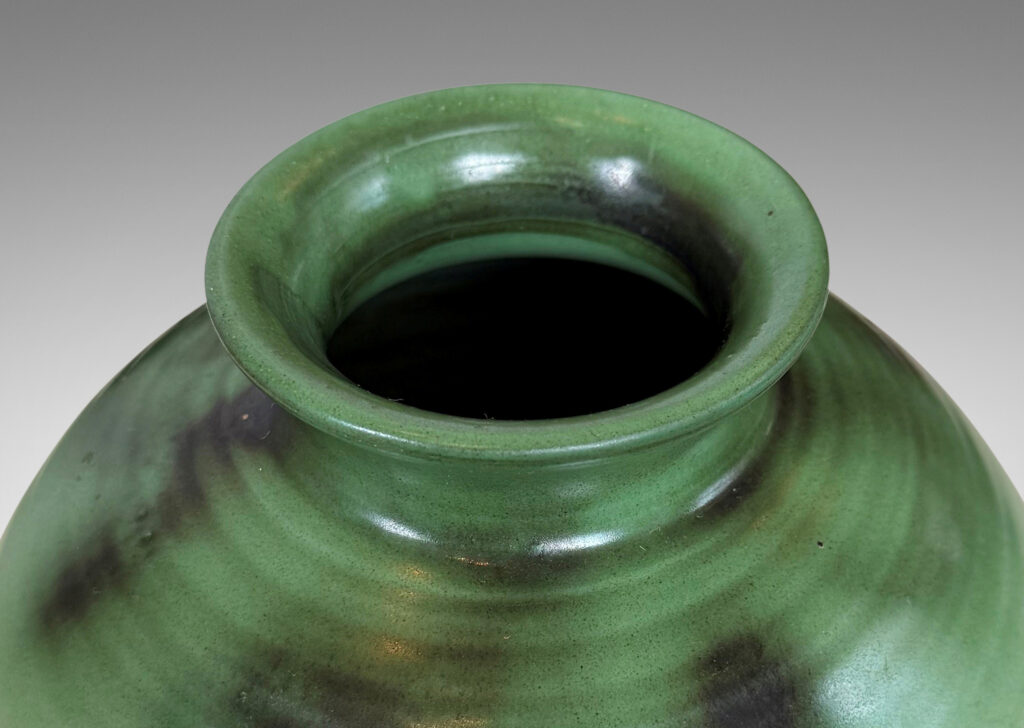 Gallery BAC ridged globe form with flared mouth, glazed in light and dark green tones