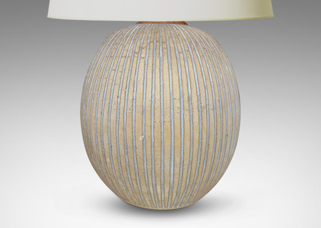 Gallery BAC light tan ovoid form with carved and white-glazed vertical pinstripes