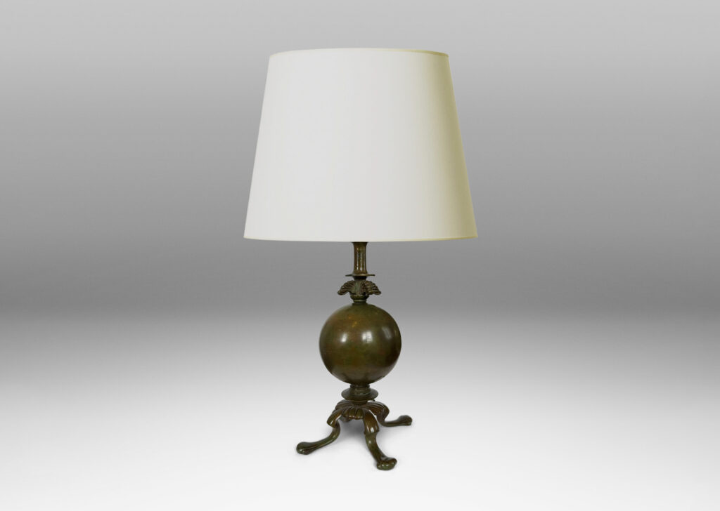 Gallery BAC spherical form on a quadrapod base with floating leaf ornaments; patinated bronze