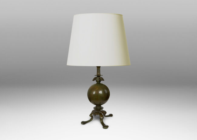 Gallery BAC spherical form on a quadrapod base with floating leaf ornaments; patinated bronze
