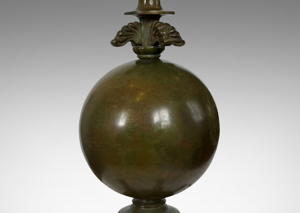 Gallery BAC spherical form on a quadrapod base with floating leaf ornaments; patinated bronze
