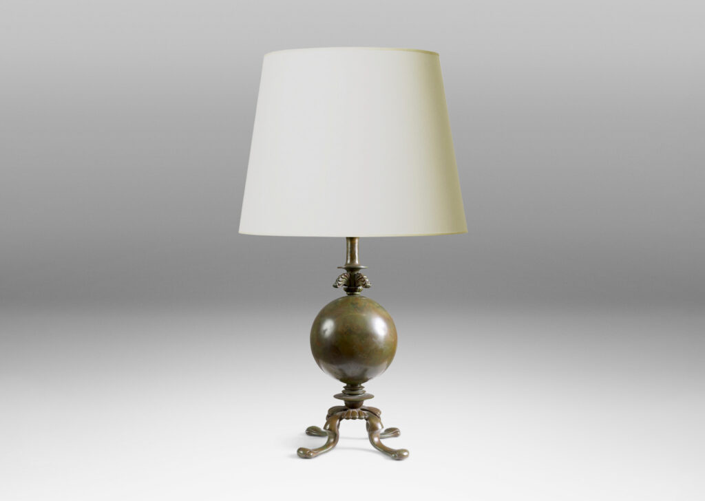 Gallery BAC spherical form on a quadrapod base with floating leaf ornaments; patinated bronze