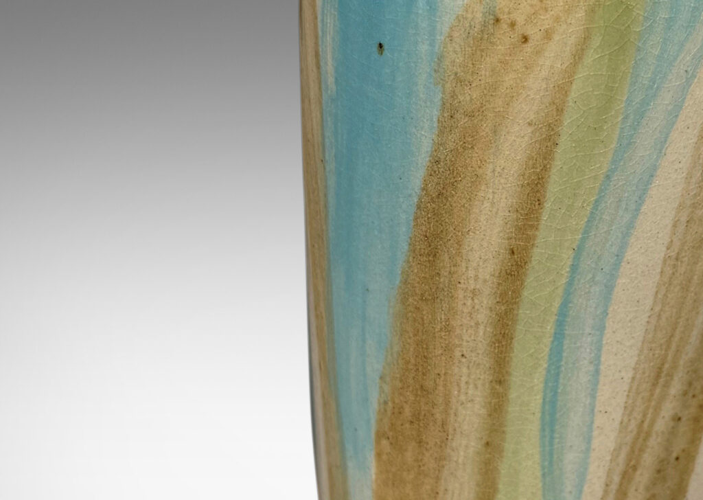 Gallery BAC upwardly tapered cylindrical form with reveal base and flange top, glazed in pale beige, with airily painted design in light brown, blue and green