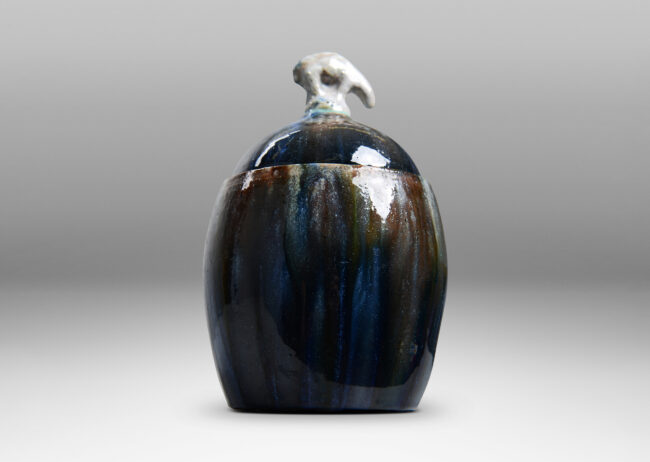 Gallery BAC oval form with finial in the form of a polar bear, glazed in green-brown, blue and white