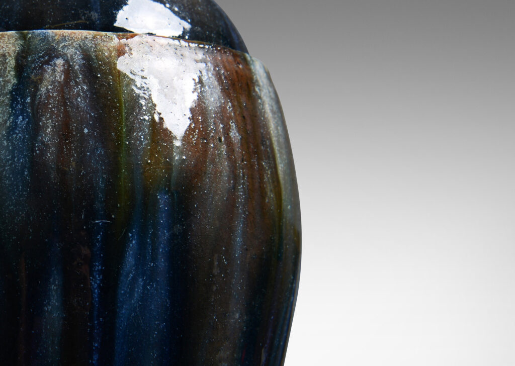 Gallery BAC oval form with finial in the form of a polar bear, glazed in green-brown, blue and white