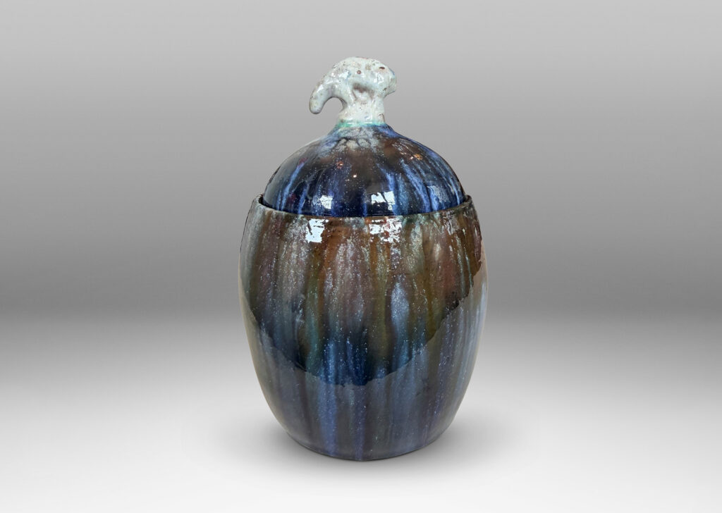 Gallery BAC oval form with finial in the form of a polar bear, glazed in green-brown, blue and white