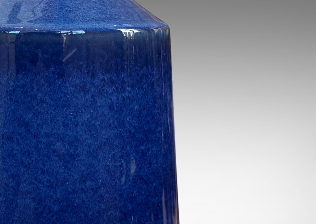 Gallery BAC angled bottle form glazed in a glossy deep blue