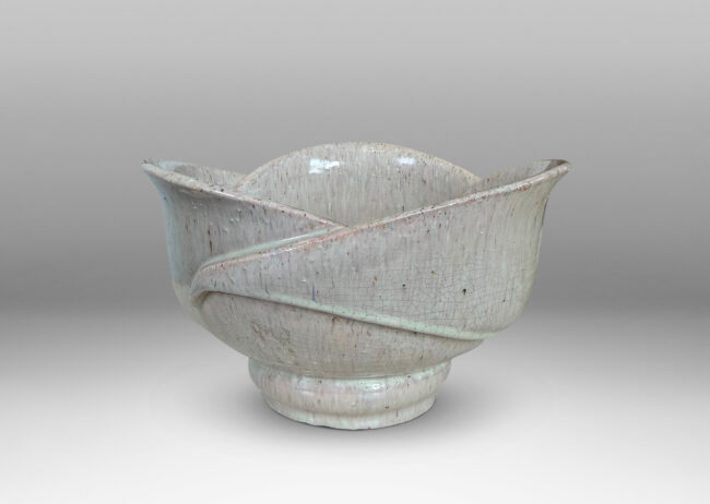 Gallery BAC footed abstracted floral design with overlapping petal forms, glazed in a flowing pale rose-gray