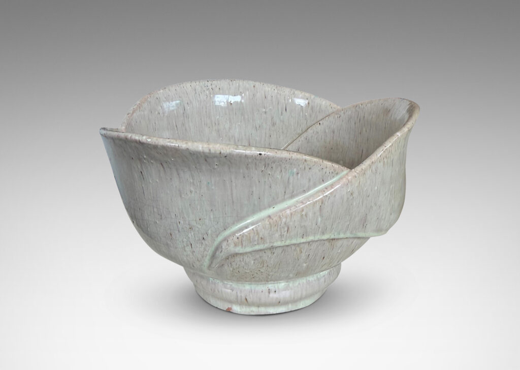 Gallery BAC footed abstracted floral design with overlapping petal forms, glazed in a flowing pale rose-gray