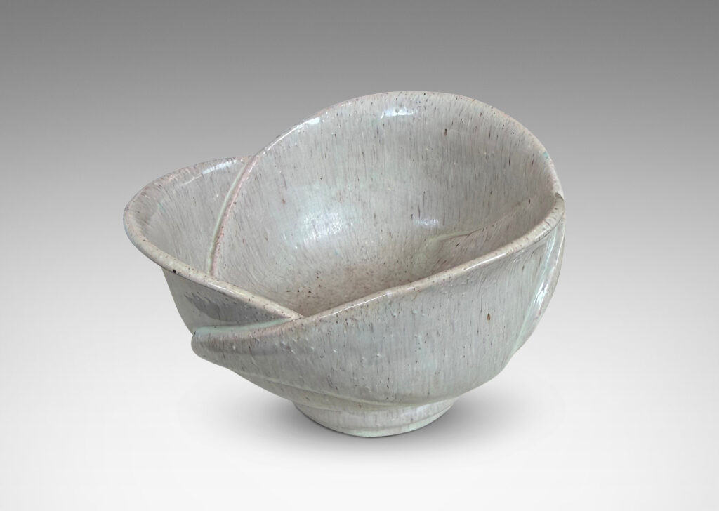 Gallery BAC footed abstracted floral design with overlapping petal forms, glazed in a flowing pale rose-gray