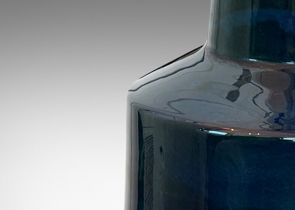 Gallery BAC cylindrical form with tall conical neck, glazed in a shiny teal blue