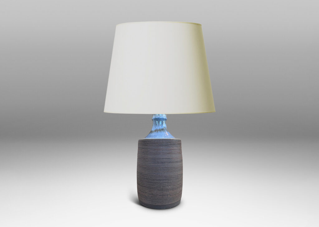Gallery BAC plump cylindrical form with raked matte brown finish, and a glossy pale gray shoulder
