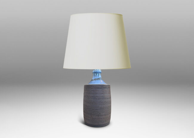 Gallery BAC plump cylindrical form with raked matte brown finish, and a glossy pale gray shoulder