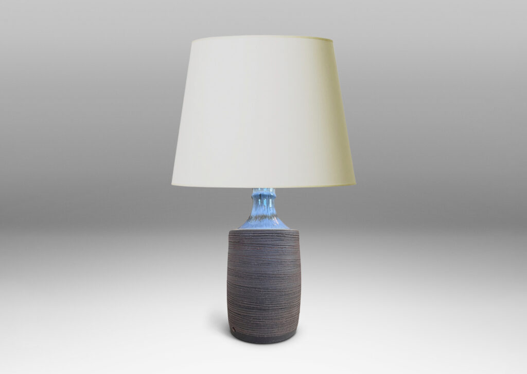 Gallery BAC plump cylindrical form with raked matte brown finish, and a glossy pale gray shoulder