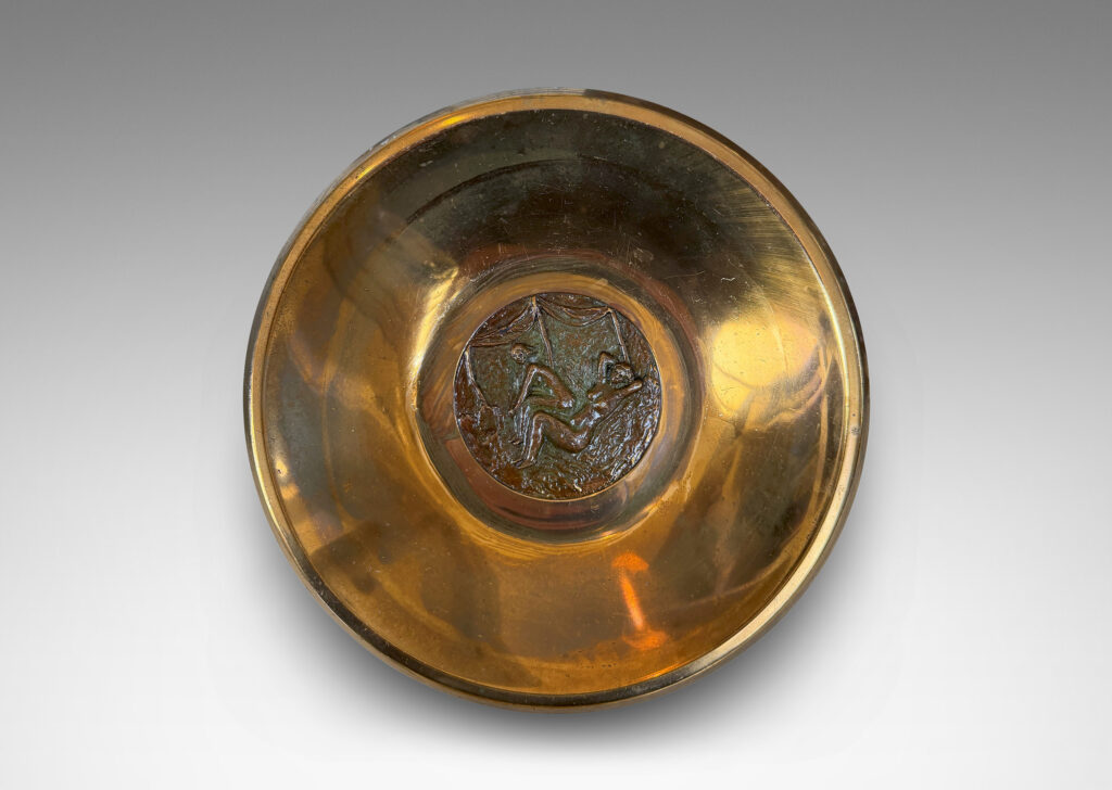 Gallery BAC sculpted form on a reveal plinth, with a central patinated medallion featuring female figures