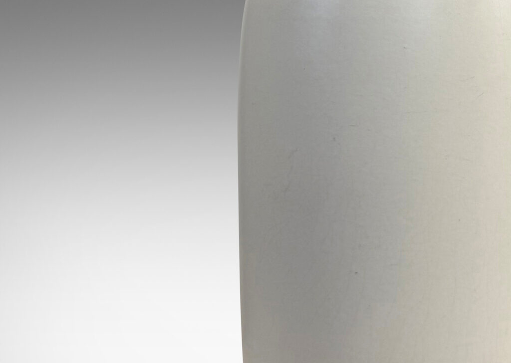 Gallery BAC all straight-sided ovoid form, with reveal base and flange lip, glazed in a velvet finish white with warm gray