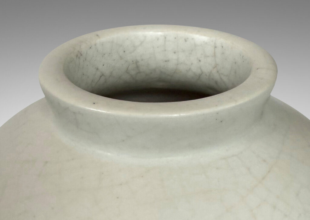 Gallery BAC small globe form with cuff lip, glazed in a velvet finish white with warm gray