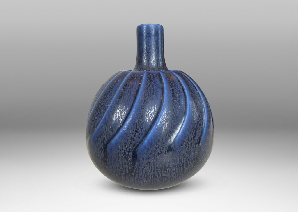 Gallery BAC globe form with swirling reliefs, glazed in a matte lapis blue