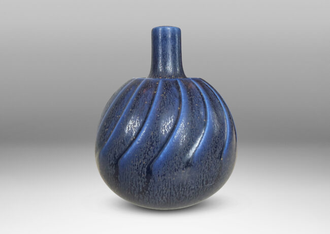 Gallery BAC globe form with swirling reliefs, glazed in a matte lapis blue