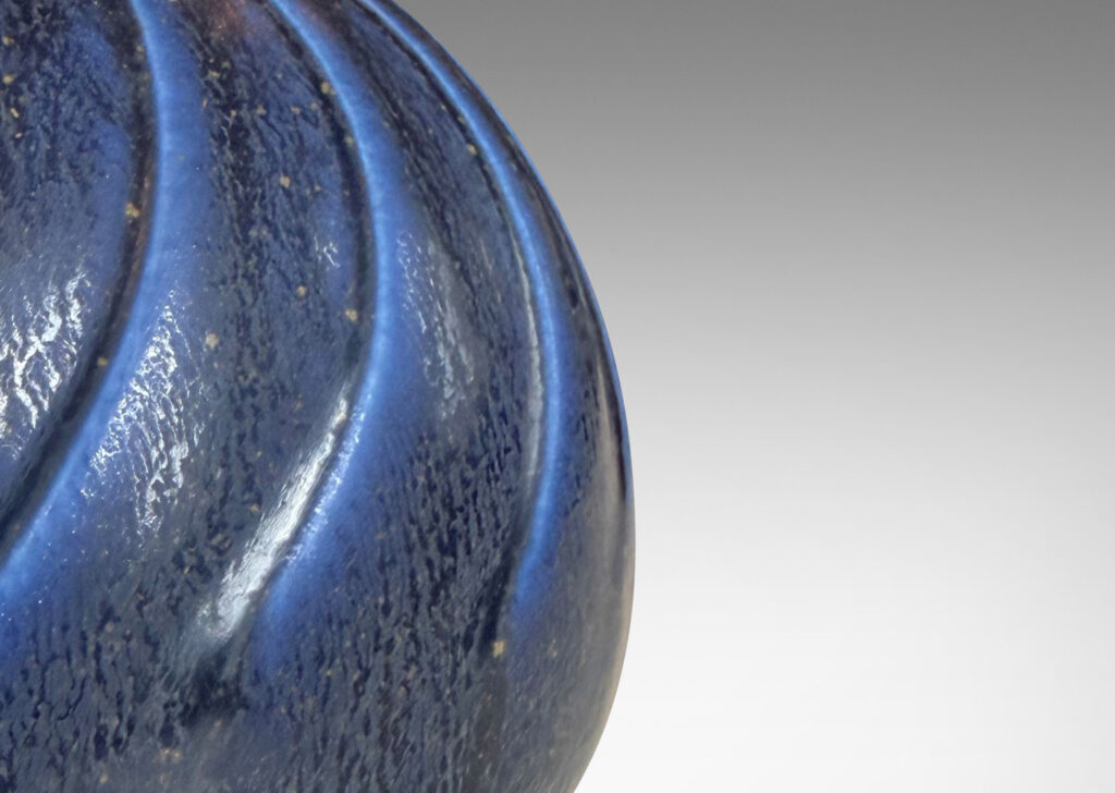 Gallery BAC globe form with swirling reliefs, glazed in a matte lapis blue