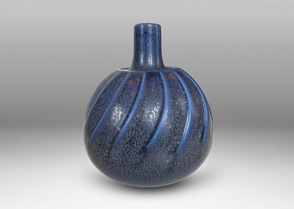 Gallery BAC globe form with swirling reliefs, glazed in a matte lapis blue