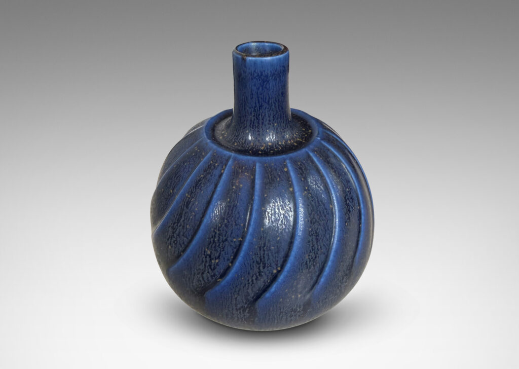 Gallery BAC globe form with swirling reliefs, glazed in a matte lapis blue