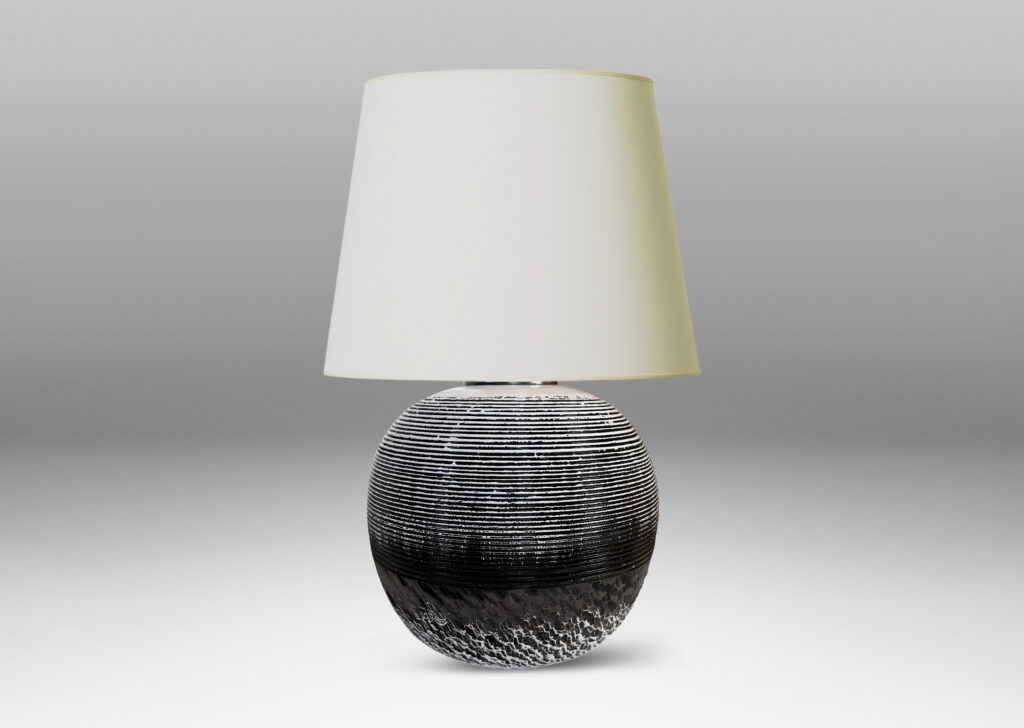 Gallery BAC globe form with carved horizontal ribbing on top and rustic texture on the bottom, glazed in matte brown and shiny white