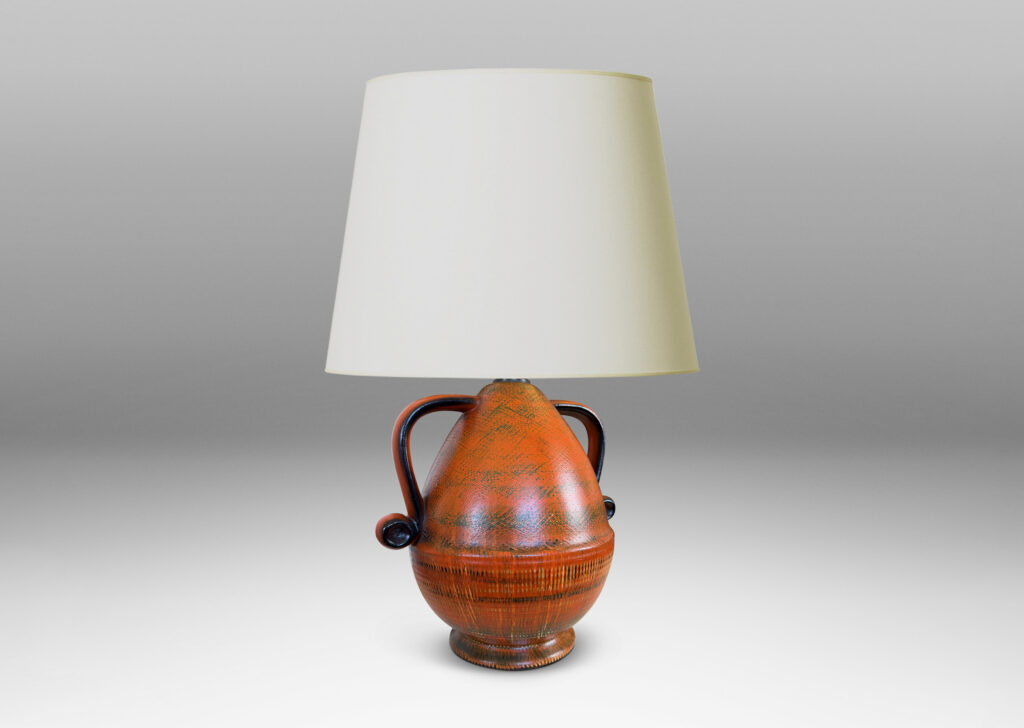 Gallery BAC upturned acorn form on a flared foot with scroll handles, glazed in brush textured orange and black