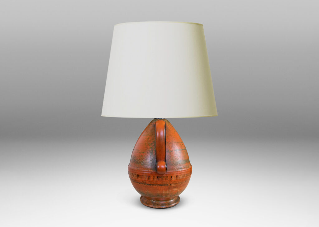 Gallery BAC upturned acorn form on a flared foot with scroll handles, glazed in brush textured orange and black
