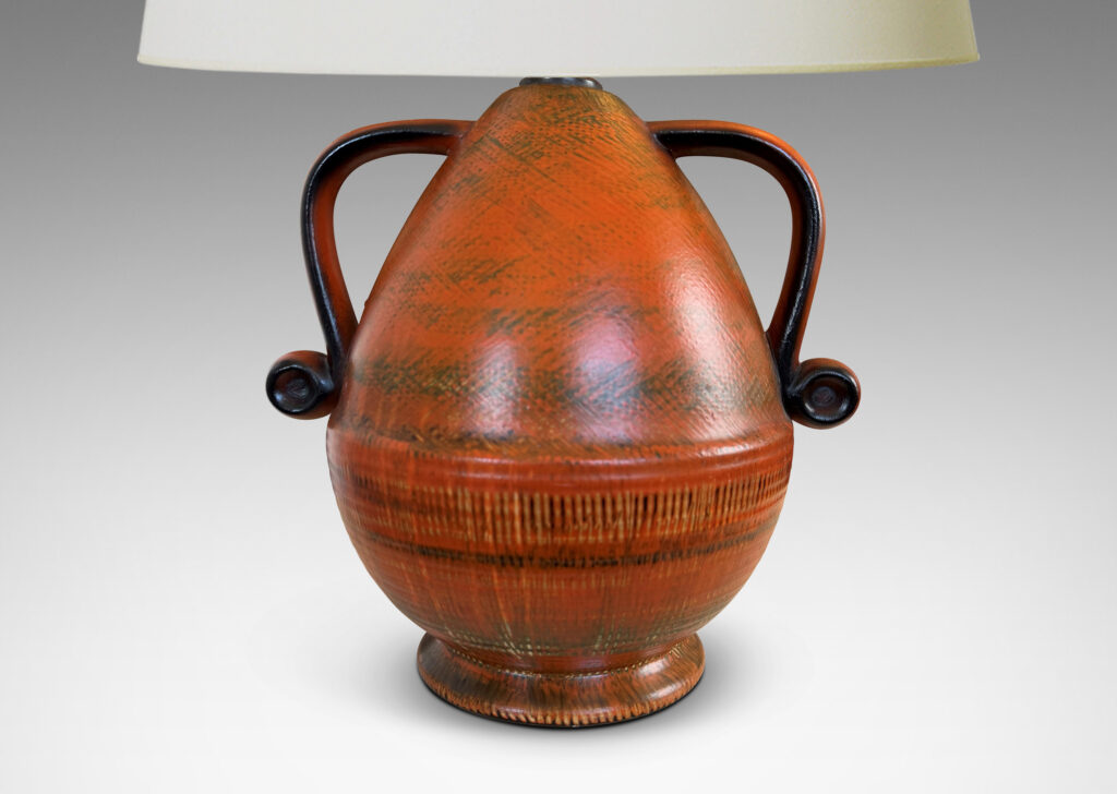 Gallery BAC upturned acorn form on a flared foot with scroll handles, glazed in brush textured orange and black