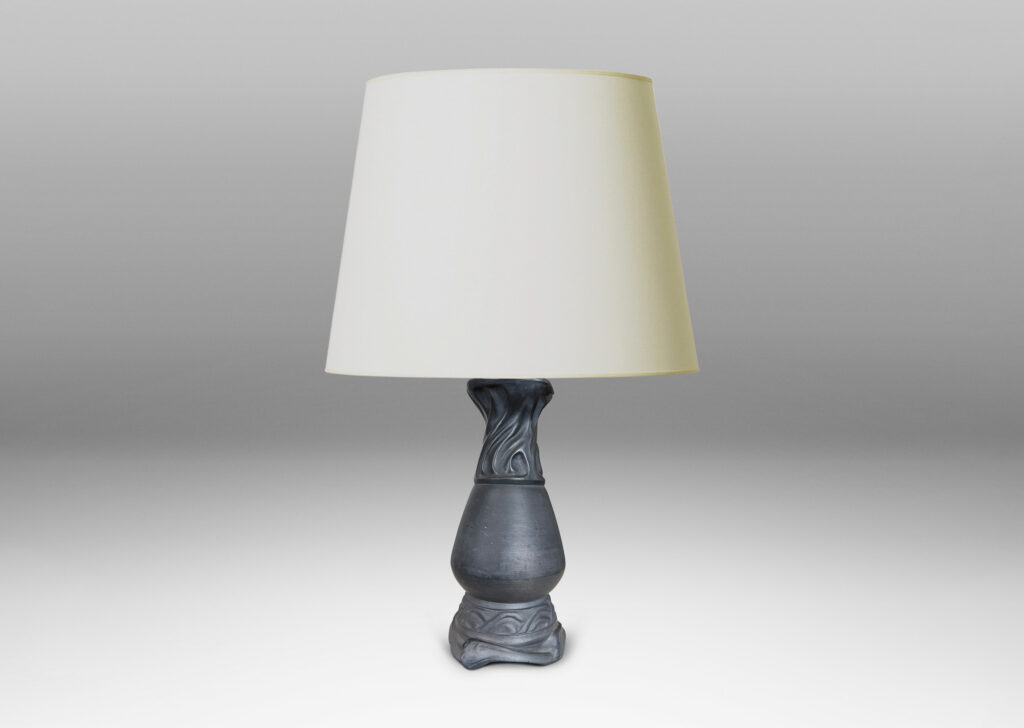 Gallery BAC swelling vase form with swirling rocaille relief base and neck in matte black
