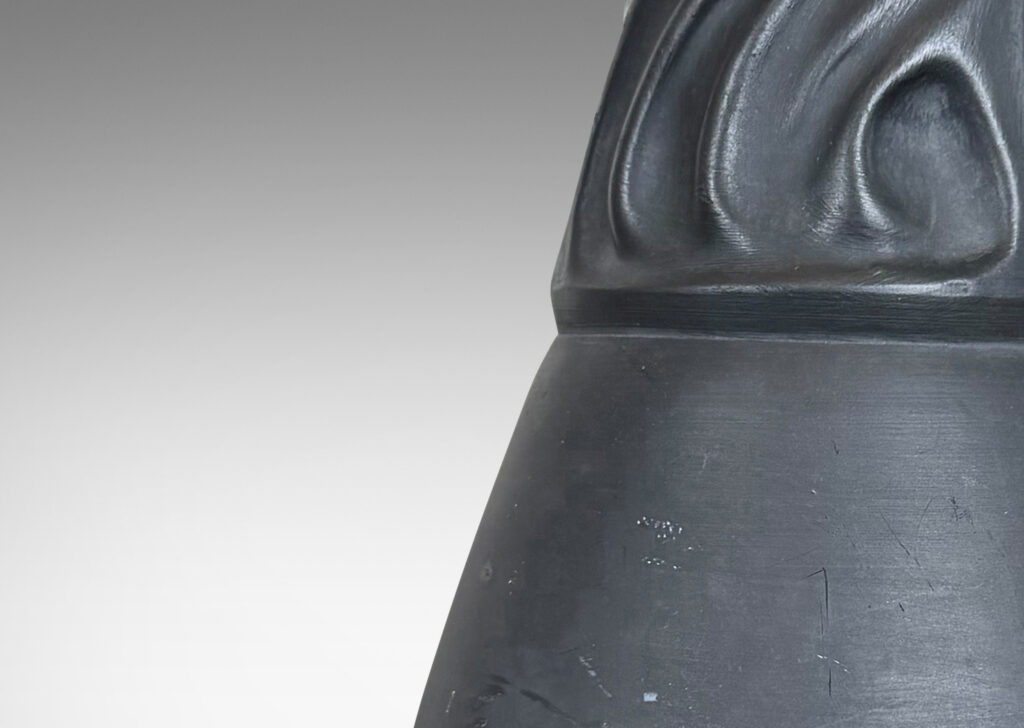 Gallery BAC swelling vase form with swirling rocaille relief base and neck in matte black