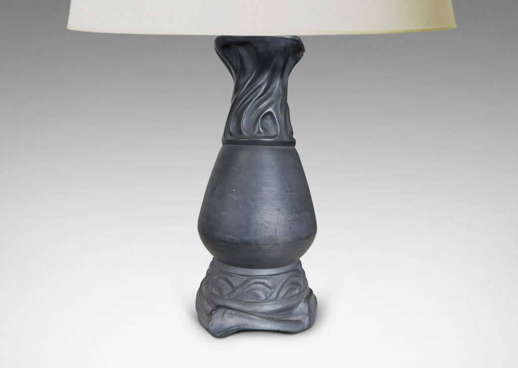 Gallery BAC swelling vase form with swirling rocaille relief base and neck in matte black