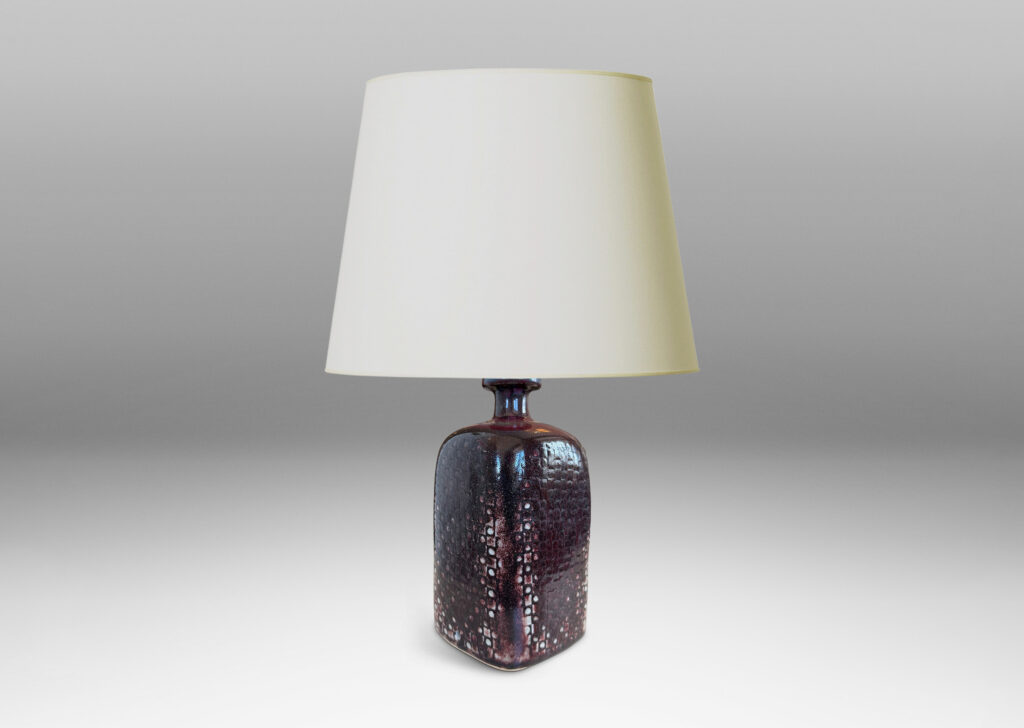 Gallery BAC tall squared bottle-like form with impressed checker circle-square pattern, glazed in flowing oxblood burgundy
