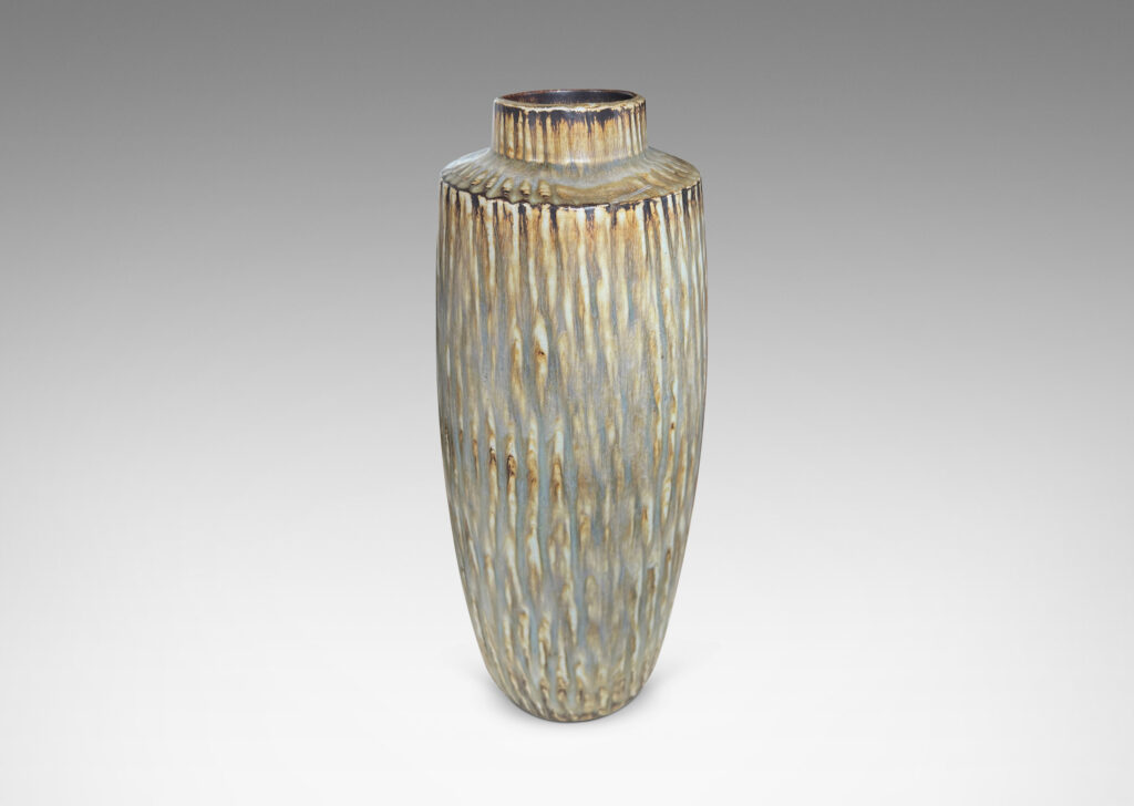 Gallery BAC large swelling cylinder forms with cuff necks, finished with a carved texture and flowing brown glaze over gray
