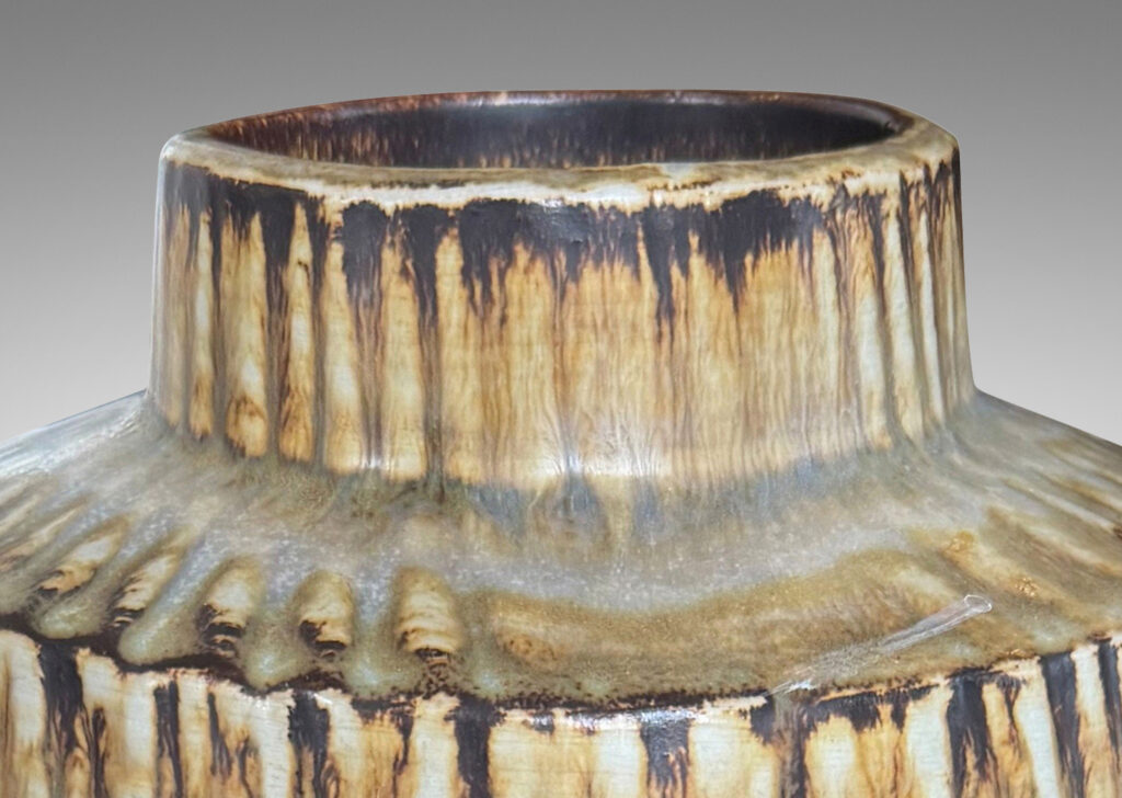 Gallery BAC large swelling cylinder forms with cuff necks, finished with a carved texture and flowing brown glaze over gray
