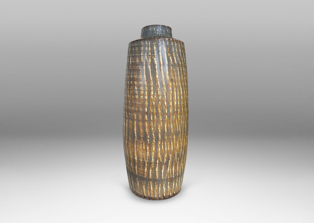 Gallery BAC large swelling cylinder forms with cuff necks, finished with a carved texture and flowing brown glaze over gray
