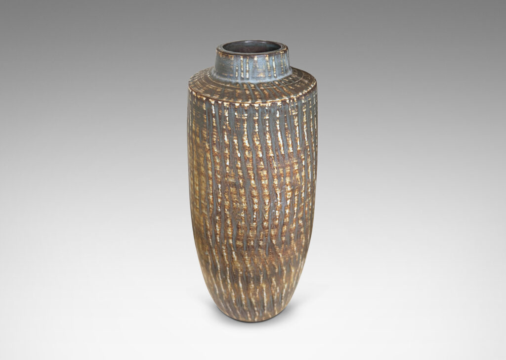 Gallery BAC large swelling cylinder forms with cuff necks, finished with a carved texture and flowing brown glaze over gray