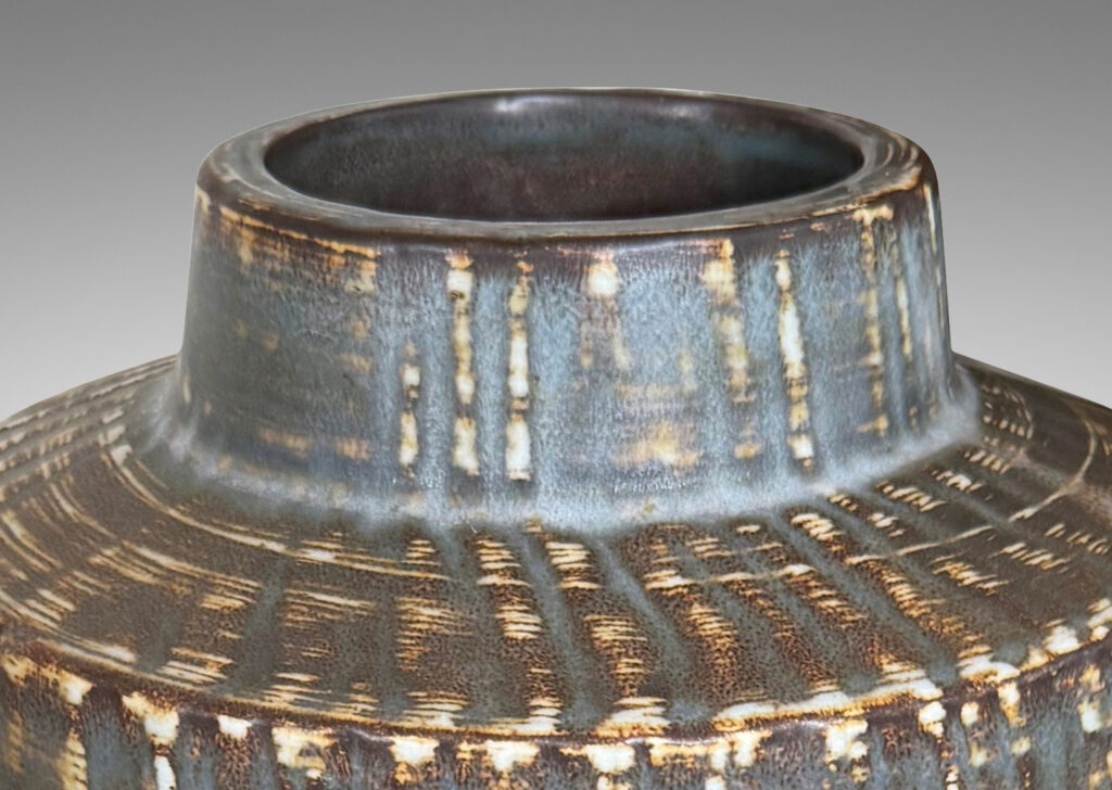 Gallery BAC large swelling cylinder forms with cuff necks, finished with a carved texture and flowing brown glaze over gray