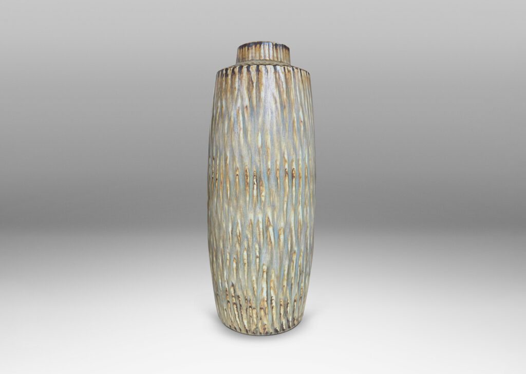 Gallery BAC large swelling cylinder forms with cuff necks, finished with a carved texture and flowing brown glaze over gray