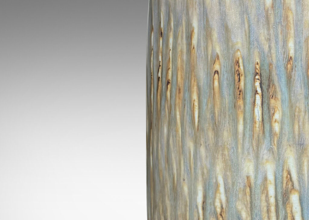 Gallery BAC large swelling cylinder forms with cuff necks, finished with a carved texture and flowing brown glaze over gray