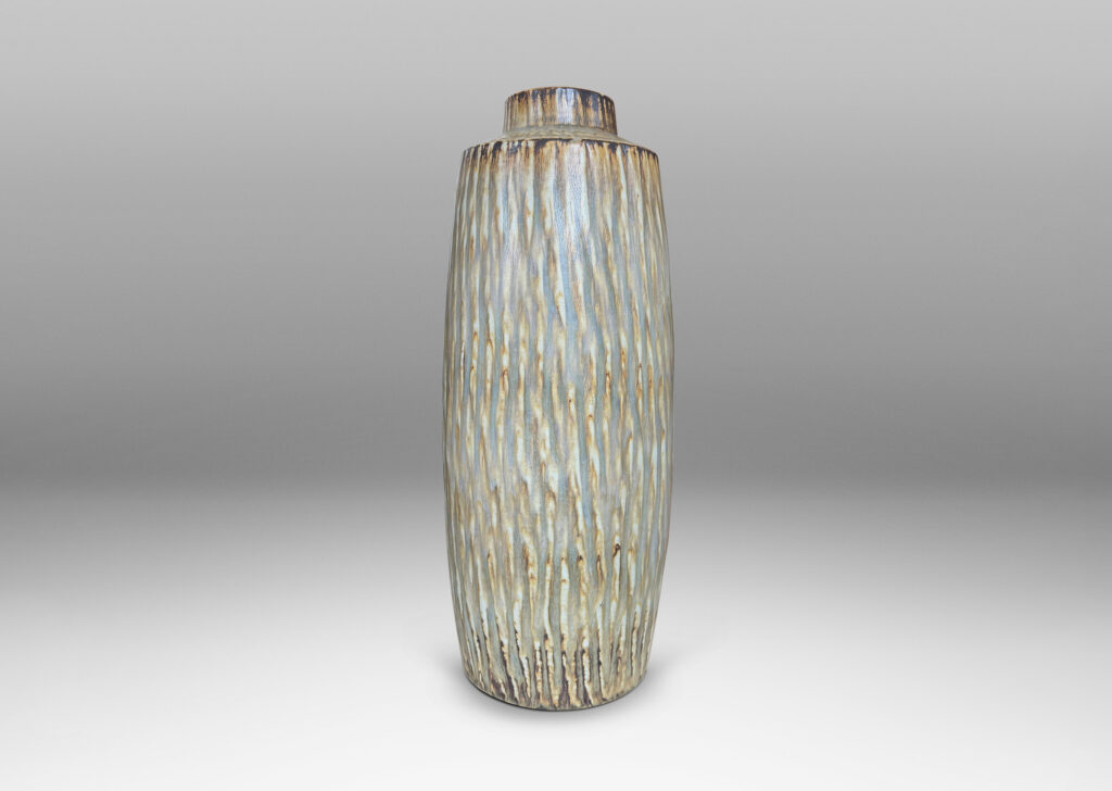 Gallery BAC large swelling cylinder forms with cuff necks, finished with a carved texture and flowing brown glaze over gray
