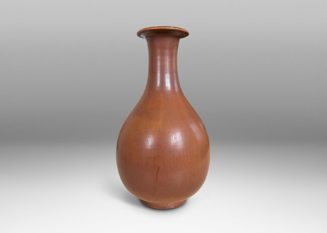 Gallery BAC swelling form with sprouting neck and flared lip, glazed in soft brown tones