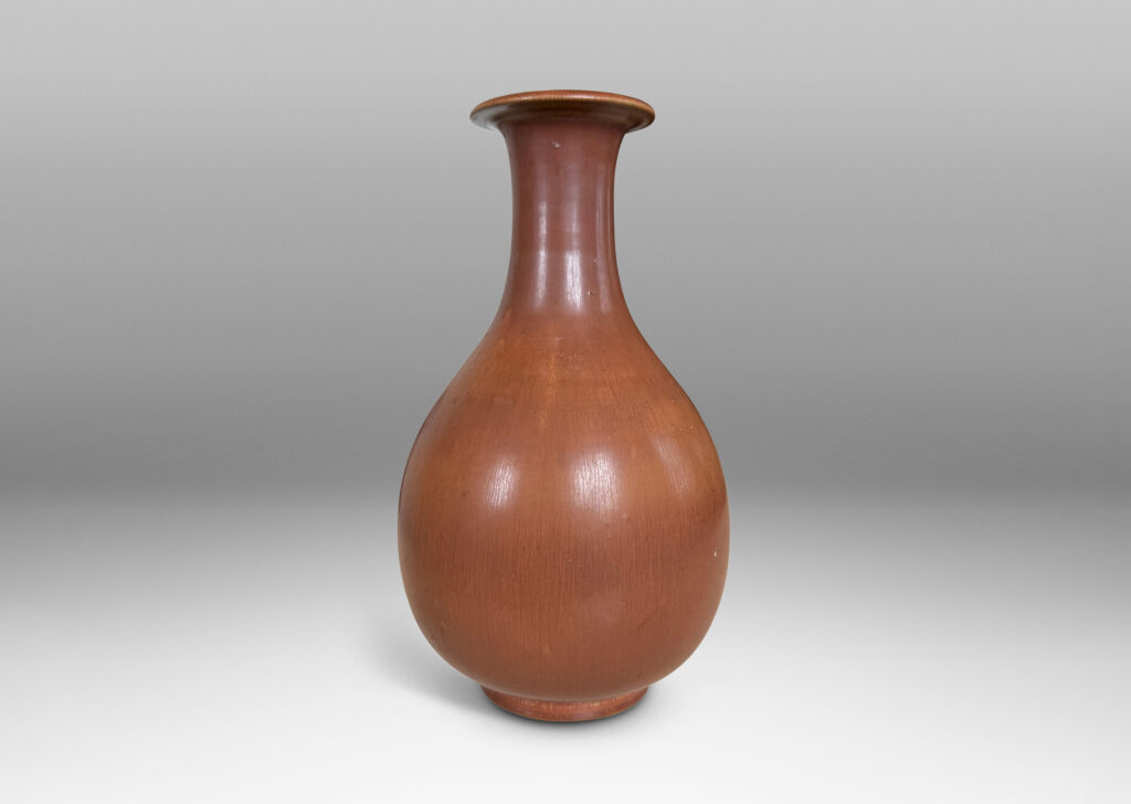 Gallery BAC swelling form with sprouting neck and flared lip, glazed in soft brown tones